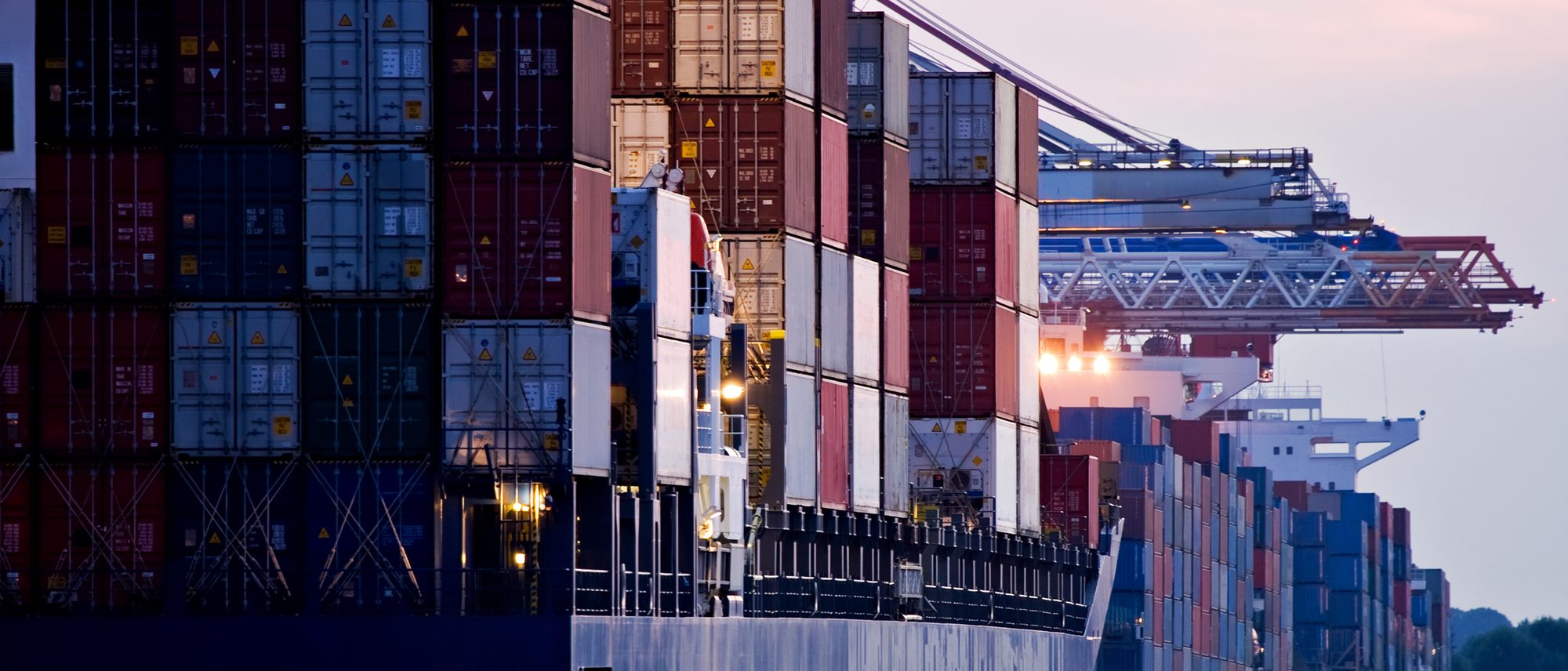 Port gantry cranes at sunset